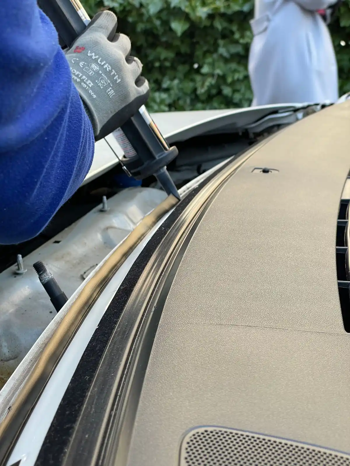 Auto glass technician repairing a windshield in Melbourne, FL